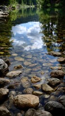 Calm waters mirror sky and stones
