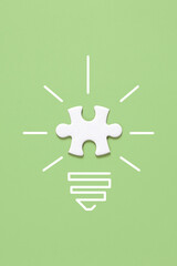 creative light bulb with puzzle piece