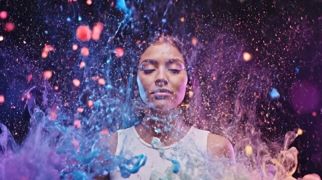 Conceptual video of a woman's head exploding into a vibrant cloud of colorful smoke and particles, symbolizing burnout, stress, digital chaos, and the overwhelming effects of information overload