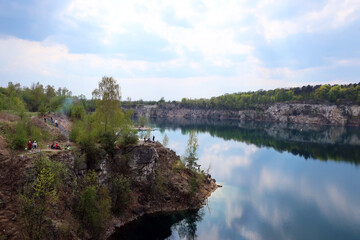 Obraz premium Zalew Zakrzówek - an artificial reservoir in Krakow in Zakrzówek. It was created in 1992 after the flooding of an old limestone quarry. It consists of two reservoirs, connected by an isthmus