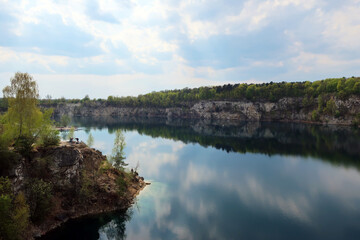 Obraz premium Zalew Zakrzówek - an artificial reservoir in Krakow in Zakrzówek. It was created in 1992 after the flooding of an old limestone quarry. It consists of two reservoirs, connected by an isthmus