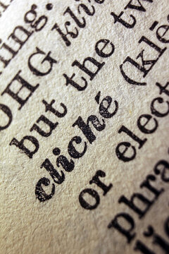 Word cliche printed on dictionary page, macro close up