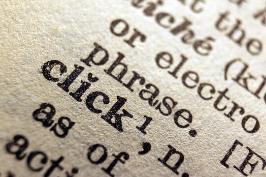 Word click printed on dictionary page, macro close up