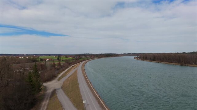 Hydraulic engineering and flood protection dam on Inn River in Bavaria Germany. High angle perspective riverbed water level and ecosystem. Sustainable water management, infrastructure in Deutschland