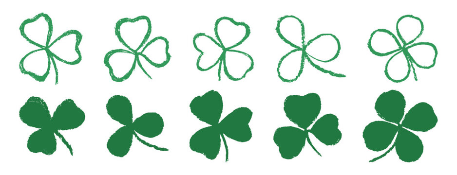 Crayon clover leaves isolated on white background. Set of green shamrock doodles illustration. Lucky shamrock