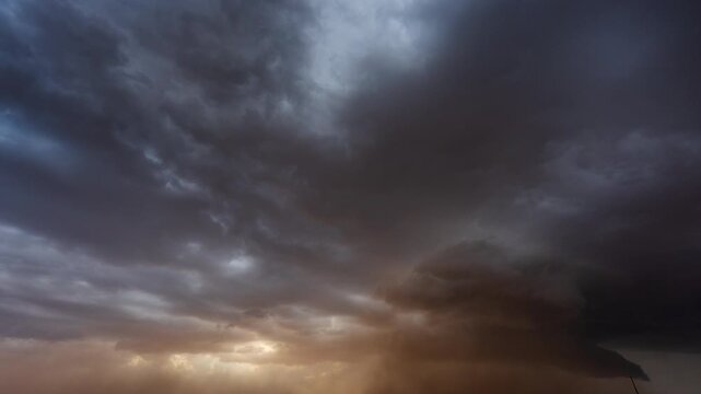Grey storm clouds moving rapidly across the sky showing dramatic weather change outdoors
