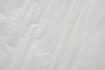 Obraz premium Crumpled White Plastic Sheet Surface Texture Background