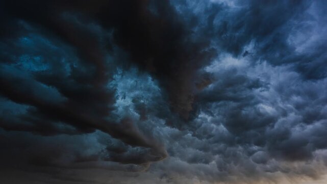 Moody sky filled with moving cloud layers forming dramatic atmospheric patterns