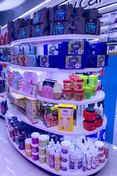Primor shop shelves display a wide selection of beauty and personal care products in a modern retail interior in Malaga, Spain.