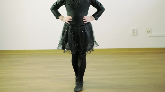 young girl in black dress performing ballet dance, dance performance, childhood memories, artistic expression and discipline