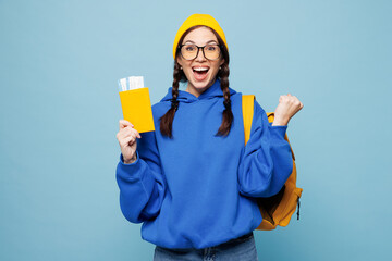 Young happy smart traveler woman student she wear casual clothes yellow backpack bag hold passport...