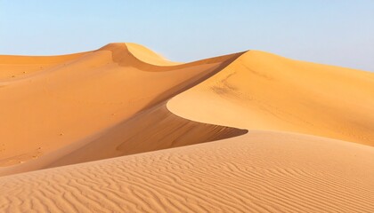 Sandy dunes stretching across the desert landscape under a clear blue sky