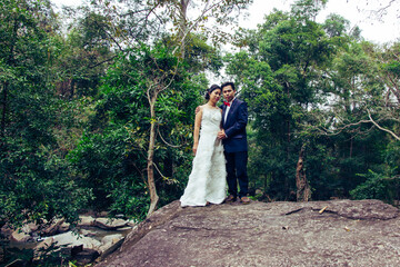 Portrait Wedding on rocks with river Wedding in Asia