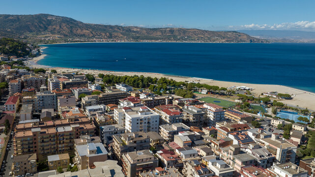 Aerial view of the town of Soverato, located on the Ionian coast of Calabria, in the province of Catanzaro, Italy. It is a popular summer tourist destination and has a large seafront promenade.