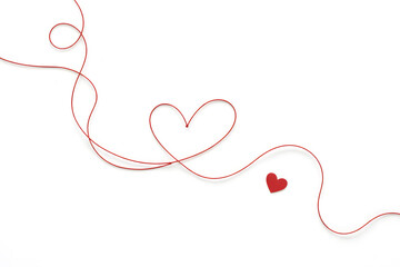 Minimalism of Love: Red String in a Heart Shape on White.
