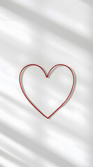 Minimalism of Love: Red String in a Heart Shape on White.