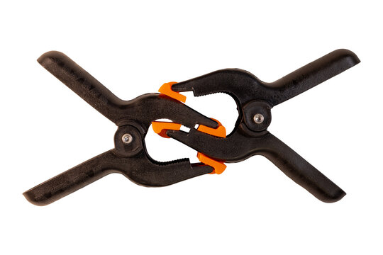 Two black spring clamps interlocked with orange pivoting jaw pads