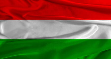 Obraz premium Flag of Hungary with fabric textured background. Close up of National flag of Hungary with realistic texture