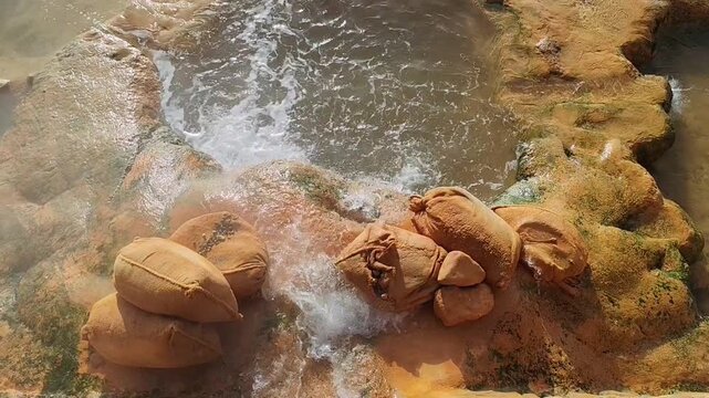 Natural thermal springs and hot pools in Loutra Edipsos, a spa town in Evia island, Greece