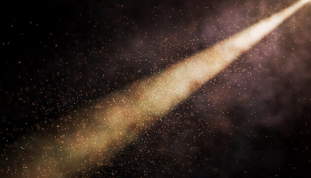 Projector beam with golden tint illuminating fine dust particles in a dark theater