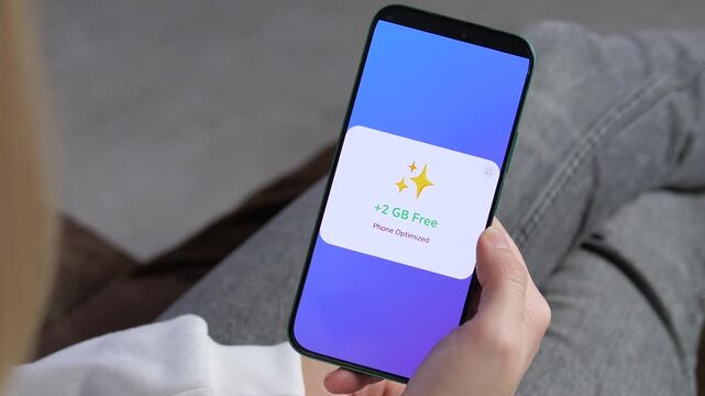 Fixing a slow phone with an optimization tool. Close-up of smartphone screen showing junk removal and storage cleaning process. Clear Phone Optimized success screen. Perfect for productivity tech and