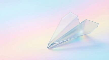 Translucent paper airplane against a pastel rainbow background.
