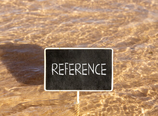 Naklejka premium References or reference symbol. Concept word Reference on beautiful black blackboard. Beautiful Red sea water background. Business references or reference concept. Copy space.