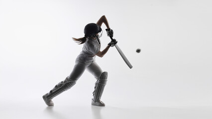 Obraz premium Female cricket batter executing controlled front foot shot. Concept of technical skill, shot accuracy, batting fundamentals, sports instruction, and professional cricket technique for coaching.