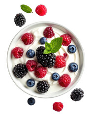 A vibrant bowl of yogurt topped with fresh raspberries, blackberries, blueberries, and mint leaves against a stark black background.