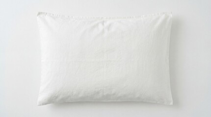 Obraz premium Soft white linen pillow on clean background for home decor inspiration