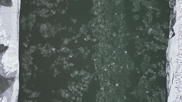 Vertical upstream flying of river ice below