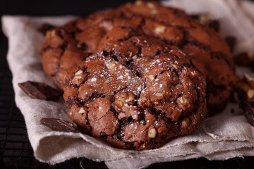 Brownie cookies are on the table. Chocolate chip cookies with nuts. Brownie.