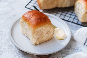 Homemade Indian pav bread or Soft dinner rolls served with butter, selective focus