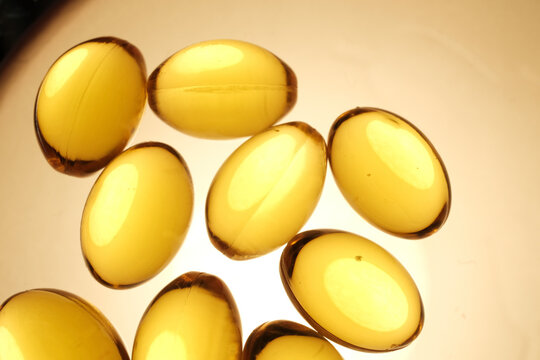 Macro Shot Of Golden Omega 3 Fish Oil Softgel Capsules Back
