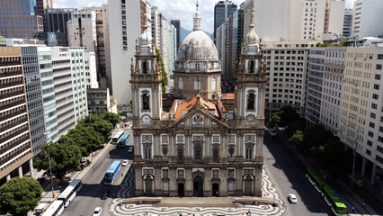 Obraz premium Candelaria Church In Rio De Janeiro Brazil. Bird Eye View Of Church Standing Tall Amidst Beautiful Scenery. Town Sky Clouds Backgrounds Urban. Town Panorama. Rio de Janeiro Brazil.