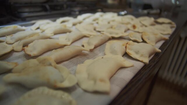 Authentic pierogi preparation in rustic home kitchen