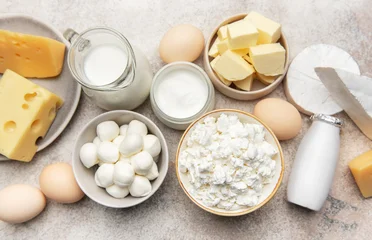 Fototapete Zu Essen Dairy products assortment showcasing fresh milk cheese butter eggs  © Olena Rudo