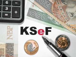 Online VAT invoice, ksef inscription next to it, calculator and Polish money