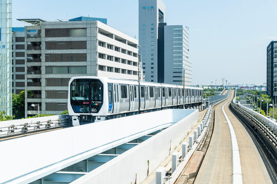 Tokyo, Japan- August 5, 2025: View of a New Transit Yurikamome line train running on the elevated track in Koto, Tokyo, Japan. It's an automated guideway transit service in Tokyo.