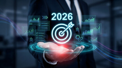 Professional businessman displaying future 2026 business goals and strategic data in a dark futuristic office setting with a focused ambitious mood