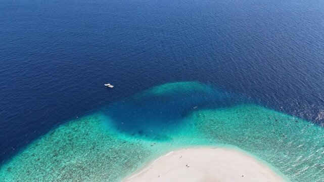 Aerial drone view of Ukulhas island Maldives surrounded by turquoise lagoon and white sand
