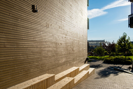 Minimal exterior urban architecture wall with concrete steps showing texture and shadow at sharp angle creating clean abstract space for design use