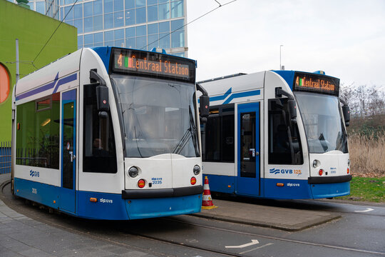 January 23, 2026, Amsterdam, Netherlands - Two GVB trams, numbered 2035 and 2065, parked on tracks displaying '4 Centraal Station'