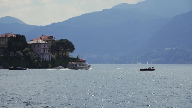 Summer landscape. View of coastal town with mountains in the background. 