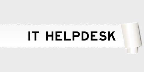 Ripped gray paper background that have word IT helpdesk under torn part