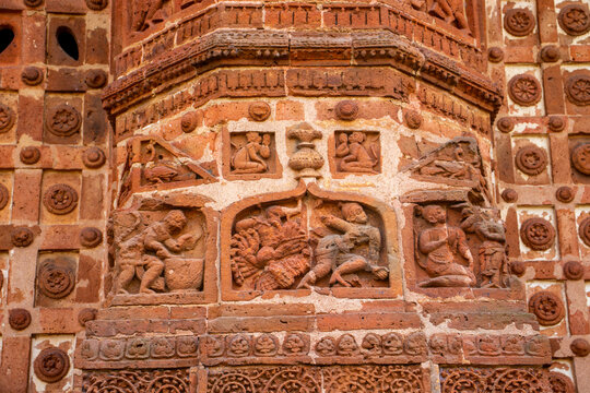 Narrative terracotta panels at Jor Bangla Temple portray warriors, hunters, animals, and dynamic scenes, reflecting Malla-era social life, mythology, and artistic mastery.
