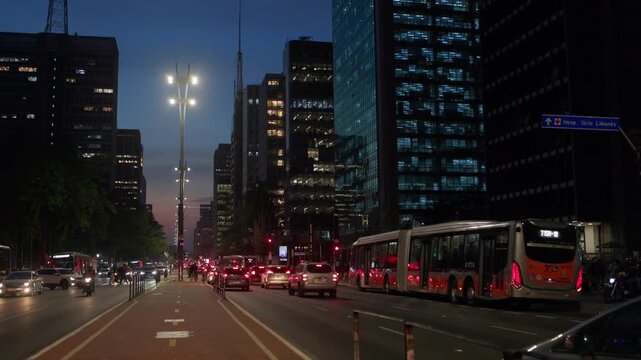 Night scene of Paulista Avenue in the city of S&atilde;o Paulo, Brazil, with a bike path in the foreground.