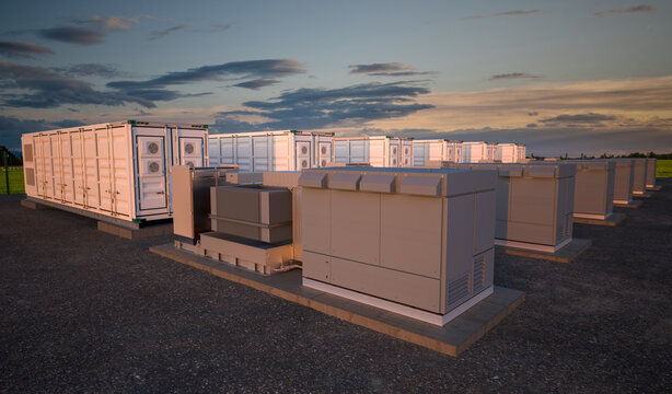 battery storage. Large white container units with dramatic sunset.