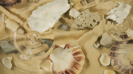 Ripples on the surface of the water against the background of seashells and stones underwater.	