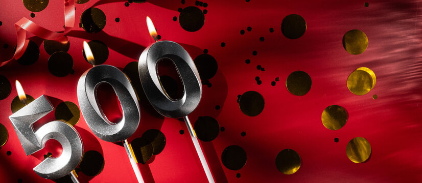 500 online community fans. Birthday burning candle number 500 on red background. Five hundred followers subscriber card. Template for blog and social networks.